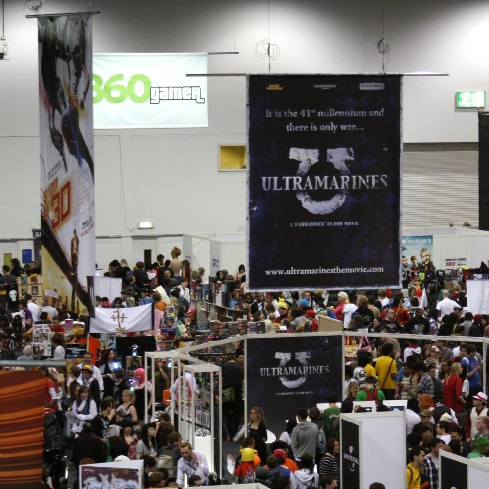 Printed backdrop banner display for a publishing stand